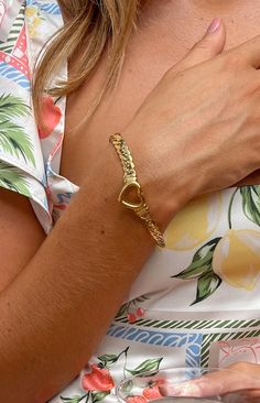 Gold Plated Heart Bracelet  How to style: For an effortlessly elevated look. add this beautiful simple gold bracelet to your outfit. This bracelet is chunky enough to stand out in a basic outfit or simple enough to blend in when paired with your next going out ensemble.  Features: Thick gold chain Clasp closure Outlined heart pendant Adjustable length Simple Gold Bracelet, Thick Gold Chain, Gold Bracelet Simple, Crochet Sandals, Beginning Boutique, Long Crop Top, Basic Outfits, Scrunchie Hairstyles, Heart Bracelet