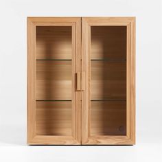 an empty wooden cabinet with glass doors