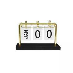 a desk clock with the word jan on it