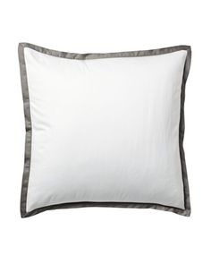 a white pillow with grey trim on it