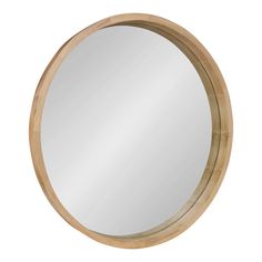 a round wooden mirror on a white background