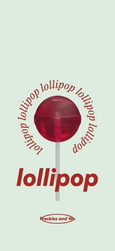 a red lollipop sitting on top of a white table