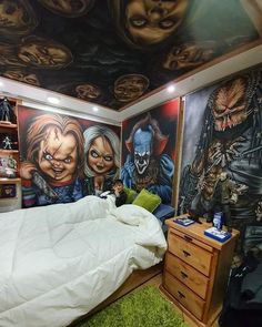 a bedroom with a large mural on the wall and a bed in front of it