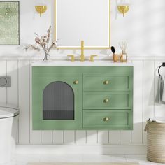 a bathroom with a green cabinet and mirror