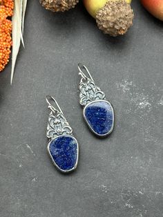 "These earrings are a statement piece to add to your collection.   Gorgeous high quality Lapis Lazuli set in fine silver with sterling silver filigree details. They have been suspended from sterling silver French hooks.  Earring Measurements: 1 1/2\" long by 5/8\" wide" Artisan Earrings, Sterling Silver Filigree, Silver Filigree, Fine Silver, Sterling Silber, Lapis Lazuli, Statement Pieces, Jewelry Earrings Dangle, Etsy Earrings