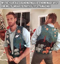 the man is wearing an ugly vest with elephants on it and has his hands in his pockets