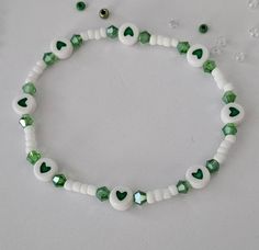 St. Patrick's Day beaded bracelet with Charms and Letter Beads, St. Patrick's Day, Stretch Bracelet This bracelet is made with custom sizing.  You choose from 6 to 8 inches. if you need a smaller or larger size please message me the details. Listing includes ONE bracelet. Any images shown with multiple bracelets is to be used as an example of how they can be stacked with other Bracelets. ALL ORDERS ARE FINAL SALE. THESE ARE CUSTOM BRACELETS MADE TO ORDER. PLEASE DOUBLE CHECK SIZE SELECTIONS PRIOR TO CHECKOUT.  CARING TIPS:  - Do not expose jewelry to water - Treat and store jewelry gently - Roll bracelets on rather than stretching band to get on. The beads used for this bracelet are small (8/0 Glass Seed Beads) and should not be used for children under 4 years old.  Please don't let the ch Concert Bead Bracelets, Double Beaded Bracelet Diy, Basic Beaded Bracelet, Cute Small Bead Bracelet Ideas, Bracelet Small Beads, St Patricks Day Bracelet, Handmade Green Heart Beaded Bracelets, Handmade Green Heart-shaped Beaded Bracelets, Mini Bead Bracelet Ideas