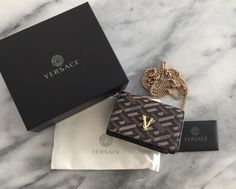 100% authentic Versace wallet on a chain. Purchase from Saks 5th Ave., Honolulu. Brand new. Smoke free home. Comes with wallet bag, duster, authenticity card, and box. Please take a look at all the pictures. And ask any questions. All sales final. Thank you Elegant Gold Wallet On Chain For Gift, Designer Gold Wallet On Chain, Luxury Rectangular Wallet On Chain As Gift, Classic Rectangular Wallet On Chain As Gift, Gold Rectangular Wallet On Chain For Gift, Rectangular Wallet On Chain Gift, Gold Rectangular Wallet On Chain As Gift, Designer Wallet On Chain With Chain Strap, Luxury Wallet On Chain For Gift