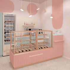 a bakery with pink walls and lots of donuts