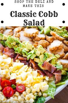 a large salad with chicken, avocado, tomatoes and lettuce on it