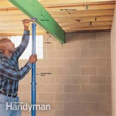 a man is measuring the height of a beam