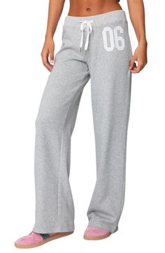 Sporty numbering at the thigh lends ultracool athletic style to these cozy cotton-blend sweatpants made with trendy wide legs. Elastic/drawstring waist 50% cotton, 50% polyester Machine wash, dry flat Imported Full-length Drawstring Sweatpants For Sports, Full Length Drawstring Sweatpants For Sports, Trendy Gray Sweatpants With Drawstring, Trendy Gray Drawstring Sweatpants, Casual Sports Sweatpants With Drawstring, Sporty Wide Leg Cotton Pants, Wide Leg Sportswear Joggers For Leisure, Sporty Wide-leg Cotton Pants, Sporty Wide Leg Cotton Bottoms