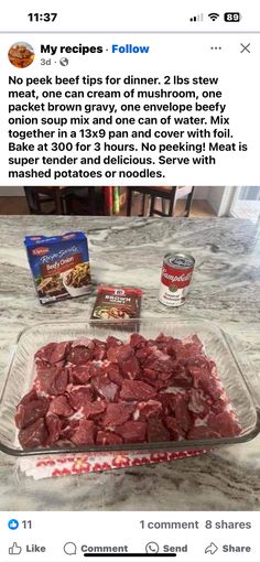 a glass dish filled with meat sitting on top of a counter next to other food items