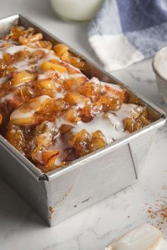 a pan filled with food sitting on top of a counter