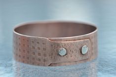 "I have a few new bracelets coming out soon and this is the first one. Made from copper with a rolled pattern in the surface and fastened together with sterling silver rivets. This bangle measures 2+1/2\" in diameter, an average size bracelet. I have applied a brushed finish inside and out and the finish will take on a nice patina. This bracelet can't be adjusted but custom sizes can be made. Check/measure the diameter of your favorite bracelet to see if this one will fit." Silver Christmas Tree, Knitting Tools, Silver Bells, Silver Christmas, Vintage Marketplace, Creative Jewelry, Handmade Artisan, Jewellery Display, Rivets