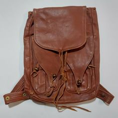 Beautiful, Handmade, Vintage Leather Knapsack. Very Nicely Made, Unique Style. There Is One Main Section Of The Bag And Two Smaller Sections On The Front Of The Bag. All Have Leather Straps For Closure. Excellent Condition, Looks Unused. Please Contact Me If You Have Any Questions At All. Thanks! Measurements Height- 16 Inches Long Width- 12 Inches Wide Depth- 2.5 Inches Retro Satchel Backpack For Travel, Vintage Backpack Shoulder Bag For Everyday, Retro Leather Travel Backpack With Adjustable Strap, Vintage Shoulder Backpack For Everyday, Vintage Standard Backpack For Trips, Vintage Leather Backpack For Trips, Vintage Brown Leather Backpack For Everyday, Vintage Satchel Backpack For Trip, Vintage Leather Shoulder Backpack For Everyday Use