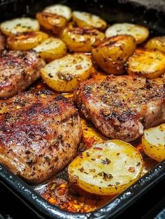 some meat and potatoes in a pan on the stove