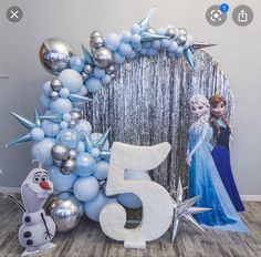 a frozen princess themed birthday party with balloons and decorations