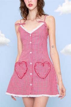 Designer Notes Step into the enchanting world of whimsical elegance with our exquisite red gingham dress called, The Dotty.As you fasten the buttons and slip into this dreamy dress, you'll be captivated by the delicate eyelet trims that adorn the neckline and hem. The eyelet details create a lovely contrast against the classic red gingham pattern, making it a standout piece for any occasion.The dress features bows on the straps, adding a feminine touch that beautifully accentuates your shoulders Red Gingham Dress, Women's Chemises, Gingham Fashion, Girls Sleepwear, Lace Material, Backless Mini Dress, Dreamy Dress, Red Gingham, Super Cute Dresses