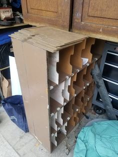 an unfinished kitchen cabinet in the process of being built with plywood and other materials