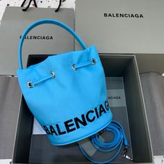 Balen Le Cagole Medium Bucket Bag In Light Blue Balenciaga Bag, Bago, Satchel Bags, Shoulder Pads, Designing Women, Bucket Bag, Contact Us, Fashion Bags, Balenciaga