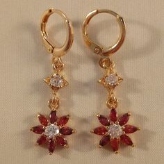 Beautiful Women's Classic Design Star Flower Sunflower Red Zircon Dangle Party Earrings 18k Yellow Gold Filled W/ Sparkling Ruby Red Marquise + Clear White Round Simulated Diamond Topaz Zircon Gemstones. Top Quality, High Polished Shine, Brand New, Never Been Worn. Lead, Nickel Free. These Gorgeous Earrings Sparkle. Perfect Jewelry For Any Special Occasion Gift Anniversary Wedding Banquet Dating Birthday Engagement Dance Holiday Party Christmas Stocking For Yourself Mom Women Or Friend. Free $18 Engagement Dance, Earthy Earrings, Flower Sunflower, Stone Dangle Earrings, Wedding Banquet, Sterling Silver Wire Wrap, Red Diamond, Sparkle Earrings, Party Earrings