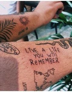 two people with tattoos on their arms that say live a life, you will remember