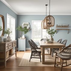 a dining room with blue walls and wooden floors