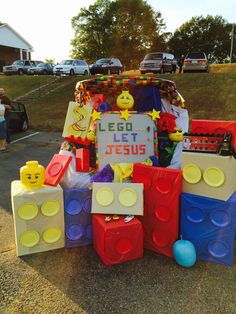 a car decorated with legos and toys in the shape of jesus's name