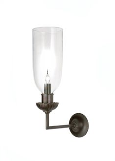 a wall light with a glass shade on it