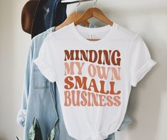 a t - shirt that says, minding my own small business