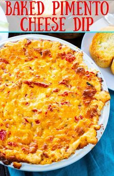 baked pimentoo cheese dip in a white dish on a blue cloth with bread