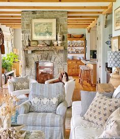 a living room filled with furniture and a fire place