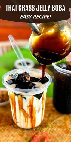 an ice cream sundae is being drizzled with chocolate