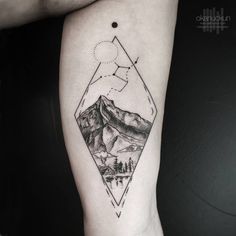 a black and white photo of mountains on the right thigh with an arrow tattoo design