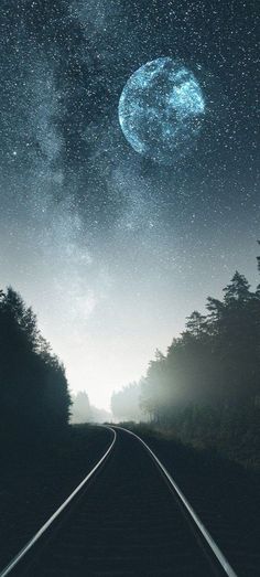 an image of a train track going to the stars