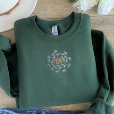 Embroidered Sweatshirt is made to order.   Great gift!  Thread colors may need to change, depending on choice of sweatshirt color.  I will send a mockup after purchase. First three photos and thumbnail are mockups to show a different color option with design. If you need a 3XL or 4XL, send me a message and I will see what I can do with color and style. Hoodies With Embroidery, Green Crew Neck Sweatshirt With Machine Embroidery, Green Crew Neck Sweatshirt With Embroidery, Green Embroidered Crew Neck Hoodie, Casual Green Sweatshirt With Embroidery, Fall Hoodie With Crew Neck And Machine Embroidery, Fall Crew Neck Hoodie With Machine Embroidery, Winter Hoodie With Crew Neck And Machine Embroidery, Crew Neck Hoodie With Machine Embroidery For Fall