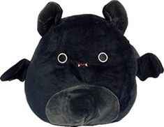 a black stuffed animal with big eyes and horns