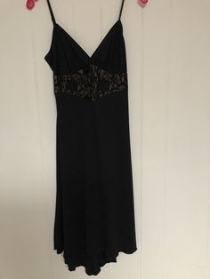 Women's Vintage 1990s Black Spaghetti strap (adjustable)  Dress.  Made by Bisou Bisou - Michelle Bohbot.  There is a black mesh covering flesh colored material at the midriff portion of the dress.  The dress is about below the knee length.  The hem is slightly scalloped with the shortest length in the front.  Tag says Size 8.  Made in USA Measurements: Bust:  32" Waist:  28" Hips:  36" Shoulder to hem:  46" (lowest scallop on the hem) Black Lace Slip Dress With Spaghetti Straps, Black Slip Dress With Adjustable Straps For Evening, Fitted Black Slip Dress With Adjustable Straps, Black Camisole Slip Dress For Evening, Black Sheer Camisole Dress, Adjustable Dress, Black Spaghetti, Black Spaghetti Strap, Black Mesh