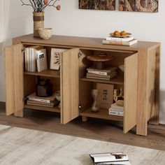 a book shelf with books and vases on it in the corner of a room