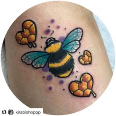 a bee with honeycombs on it's back and chest is shown in this tattoo