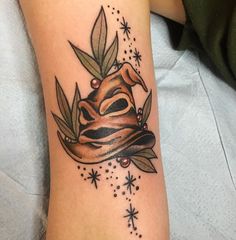 a tattoo with a hat on top of it