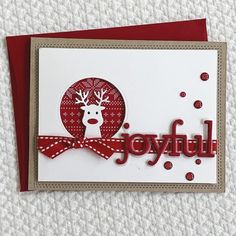 a handmade christmas card with the word joyful on it and a reindeer in a red bow