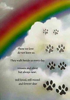 a rainbow and paw prints with the words those we love do not leave us