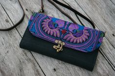 "The cross-body purse/wallet designed by oriental inspiration. It is made with an amazing piece of fabric woven by the HMONG hill tribes of Lanna Country (Northern Thailand). It feature one zippered pocket and 12 card slots. This purse will enhance your appearance! We buy materials from Hmong market and we design and sew by hand. Some of the bags we modify to improve the product. The Hmong tribes live in the North of Thailand and have origins from the Tibetan area of China. N.B. YOU MAY NOT RECE Sew By Hand, Bohemian Handbags, Boho Wallet, Embroidered Purse, Bohemian Bag, Purple Bird, Colorful Bohemian, Bohemian Bags, Northern Thailand