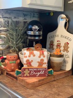 a kitchen counter with gingerbread cookies and baking supplies sitting on top of the counter