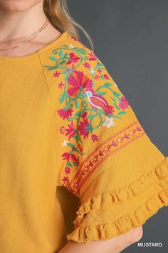 Umgee Linen blend top with layered flounce sleeves and embroidery. Fringe hemmed. Super cute blouse! Color: Mustard Sizes: S-M-L True to sizeOur model is 5' 9" wearing a small 55% Linen, 45% Cotton, importedO5/K7342