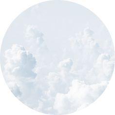 the sky is filled with white clouds in a circular shape, as well as an airplane flying overhead