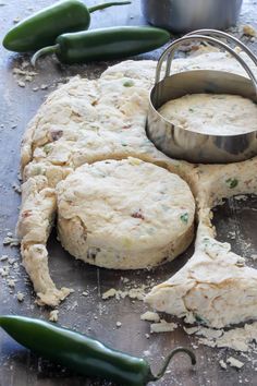 the dough has been made and is ready to be put into the oven with some green peppers next to it