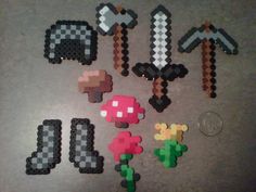 pixel art is displayed on the floor in front of a coin and some other items